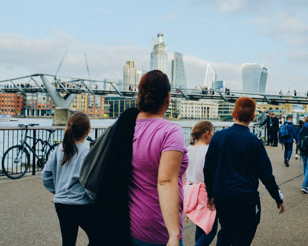 a group of people walking on a bridge